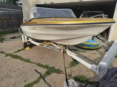 1974 glastron boat and trailer. Had a 1976 chrysler 55hp outboard, just had tune up ar dealer. Trail...