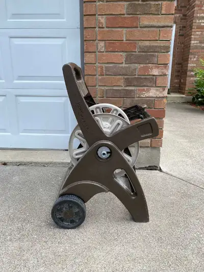 Brown hose reel or storage , View more
