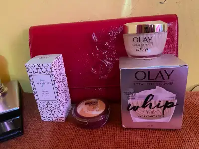 Olay Total Effects Whip,Perfume ,foundation,and YSL clutch bag ., View more