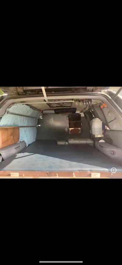 Custom made complete base with bed, stove, cooler, water canister. Lots of storage, very practical,...