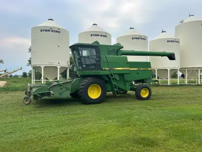 Combine with FIVE heads. 1987 John Deere 7720 Titan II combine. Has 5550 hours. This combine has bee...