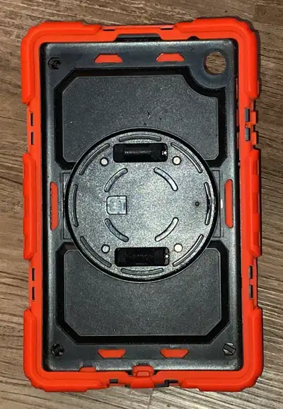 Selling a tablet case with carry handle hand strap and the stand handle rotates measures for a table...