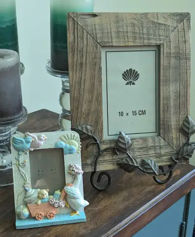 Baby frame has a photo window size of 2 x 3 inches. Rustic wood and metal frame has a photo window s...