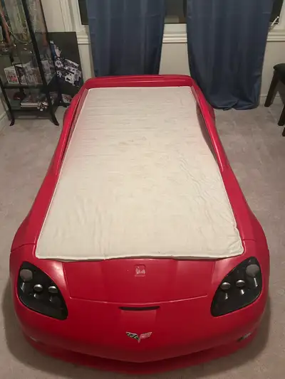 Child’s Racecar bed frame, mattress and mattress supports included. Never used, in brand new conditi...