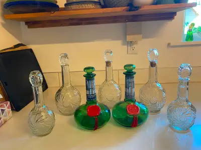 7 antique liquor bottles, View more