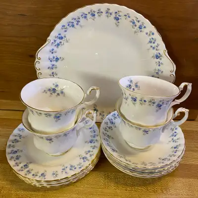 This is a 13 piece bone china tea and dessert set in the pretty “Memory Lane” pattern by Royal Alber...