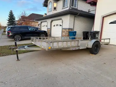 7x14 utility trailer. Has rear folding gate. It’s just not attached in the current photos. Two remov...