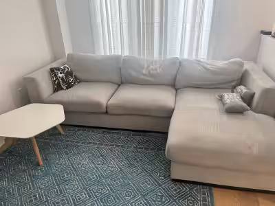 This is a comfortable sectional sofa, perfect for a living room or entertainment area. Its about 3-4...