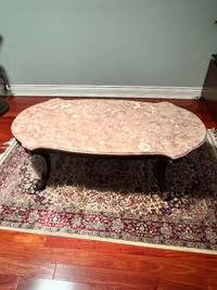 Pink marble coffee table with brown legs. Antique
