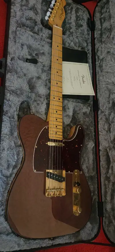 Mint condition mahogany top telecaster with (stock) custom shop pickups, tort binding, and a neck pr...