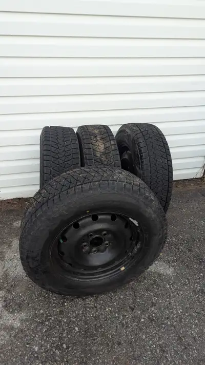 Used Bridgestone Blizzak DM-V2 snow tires on steel rims. used for only two seasons with plenty of tr...