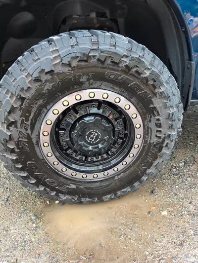 35x12.5R17 Toyo Open Country on 17" Black Rhino rims. Like new. Only used one summer. No trades