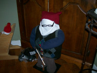 Floorstanding Christmas Mummer with ugly stick, about 2 foot hig