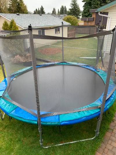 Professional grade 14 FT used trampoline with safety enclosure. Was for our competitive gymnast. Thi...