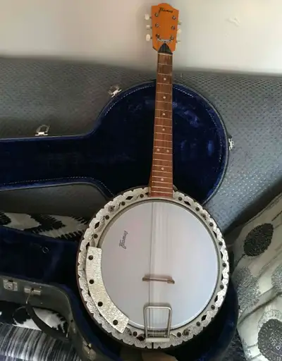 Framus banjo-guitar with original case for sale. Plays like a 6 string guitar and gives a great Banj...