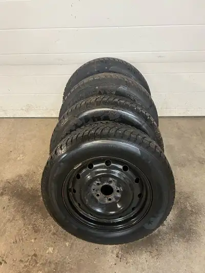 These pre-owned Blackhawk winter tires, sized 215/65R16, are mounted on steel rims and are ready to...