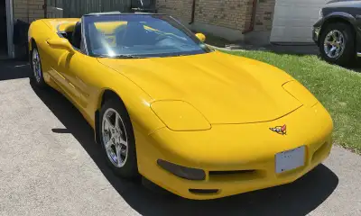 OBO. For sale is a vibrant yellow 2002 Chevrolet Corvette convertible, a true American sports car. T...
