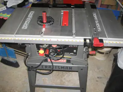 FOR SALE 10 inch Craftsman table saw with expandable sides and back used very little and is in mint...