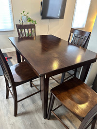  Good condition  dining room table with four chairs