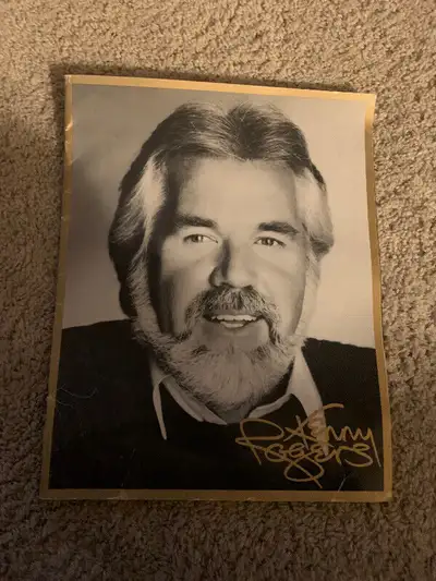 i have a kenny roger concert tour program from 1983 10 pages with signature and pictures and a cente...