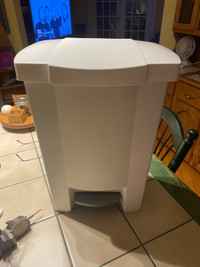  White plastic kitchen garbage pail with foot operated lid