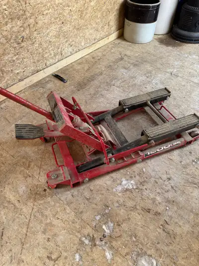 This ATV jack, capable of lifting up to 1500 lbs, is perfect for performing maintenance on your mowe...