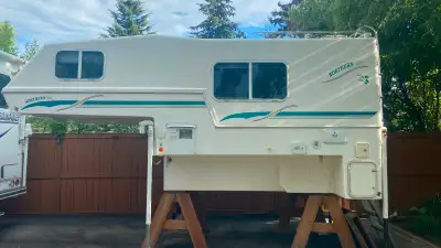 Model 10-2000 In good shape for its age Front T-wall repaired no leaks or cracks Solar panel on roof...