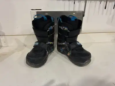 Kids size 1 snowboard boots. Velcro straps for easy on and off, but still very secure.