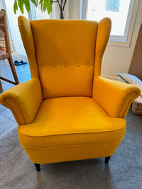 Ikea's STRANDMON Armchair in Skiftebo yellow for $290