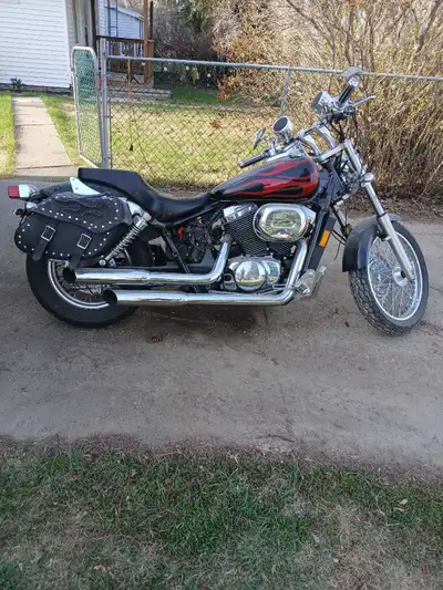 2004 shadow750, good tires, brakes,lights, saddle bags,needs battery, coil, dent on fuel tank , mila...