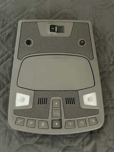 Ford F-150 overhead console, gray in colour with sunroof and rear slider switches. Removed from a 20...