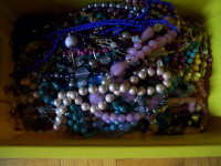 Over 60 strands of beads