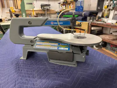 This King Canada 16" scroll saw is a variable speed tool, perfect for intricate woodworking projects...