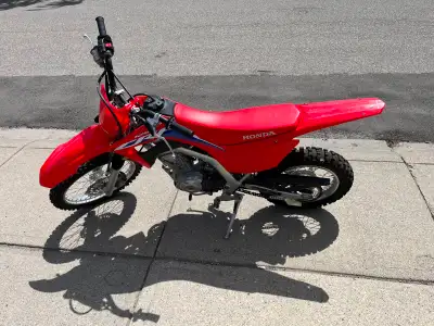 Excellent shape 2022 Honda CRF125 21 Hrs on it Kick & E-Start Stored inside No damage Helmet, Boots,...