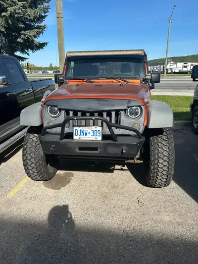 2011 Jeep wrangler with new lift kit and tires. Easily certified and willing to work with serious bu...