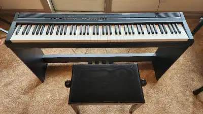 Piano with integrated stand Excellent condition, barely used Height adjustable bench included Manufa...