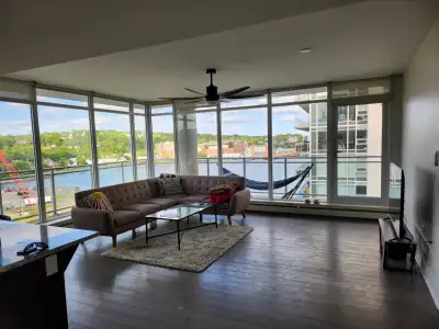 Wake up to wall-to-wall views of Halifax Harbour from your 8th-floor corner unit at Kings Wharf! Wit...