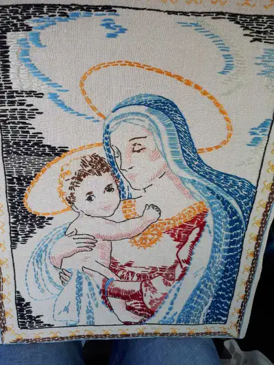 Very rare unframed stitched art of baby Jesus and Mother Mary. Asking $200 and can deliver