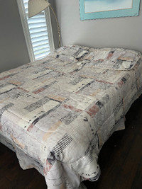 Queen Comforter with matching shams and bed skirt.