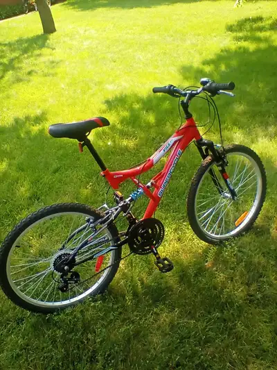 Supercycle mountain bike, dual suspension, 18 speed, 24 inch wheels, kickstand and bell, good for yo...