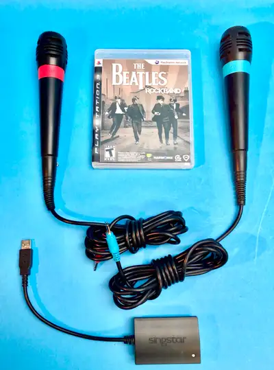 PS3 The Beatles Rock Band Game + 2 Sing Star Microphones, View more