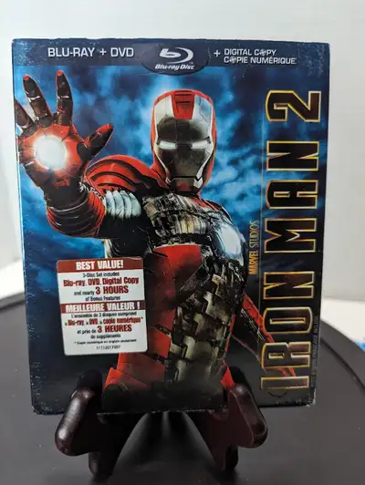 With the world now aware of his identity as Iron Man, Tony Stark must contend with both his declinin...