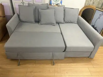 IKEA sofa bed with removable covers and reversible chaise Couch is in great condition Covers are rem...