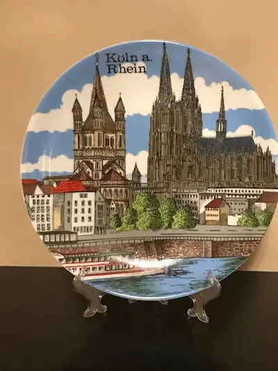 Brand New with Stand This vintage Koln, Germany china souvenir plate has scenic landmarks of Koln, G...