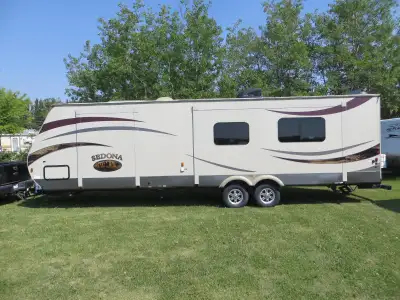 This is a well kept 2 owner hard wall model travel trailer that sleeps 6, has 2 electric slides the...