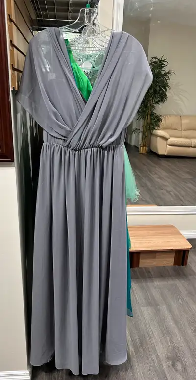 Brand new barijay formal dress which has multiple styling options with the convertible ties. Size 12...
