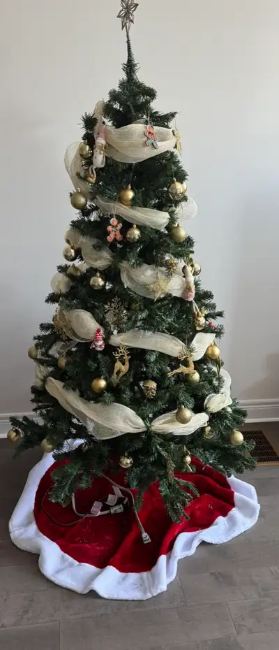 Selling a 6-foot artificial Christmas tree in great condition. Comes with built-in lights and plenty...