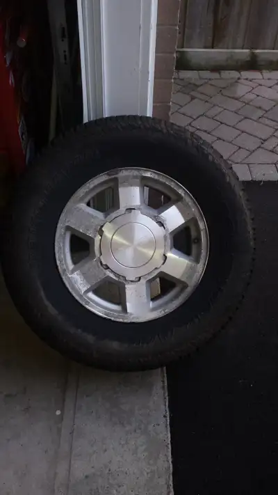 Set of 4 OEM wheels from GMC Sierra with 265/70/R17 113T Yokohama Geolandar A/T G015 4-season tires...