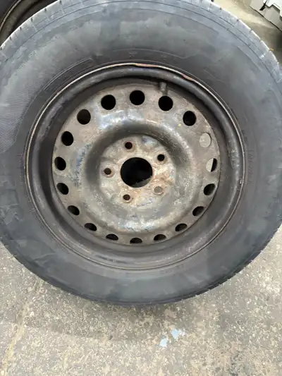 4 tires with rims . all season decent tread