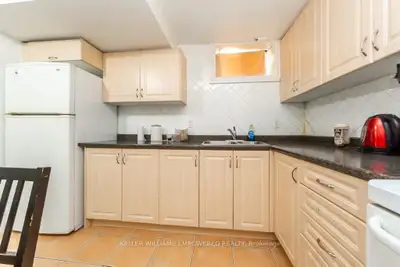 This cozy 2-bedroom basement apartment offers a functional living space with a well-equipped kitchen...